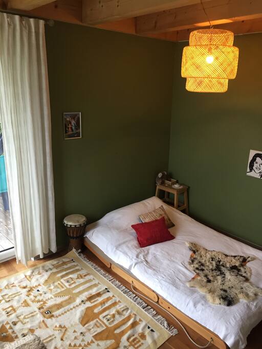 The bed is 120 cm x 200 cm. It’s rather tight for two people!