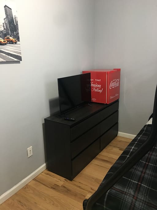 Bedroom with minifridge and smart TV
