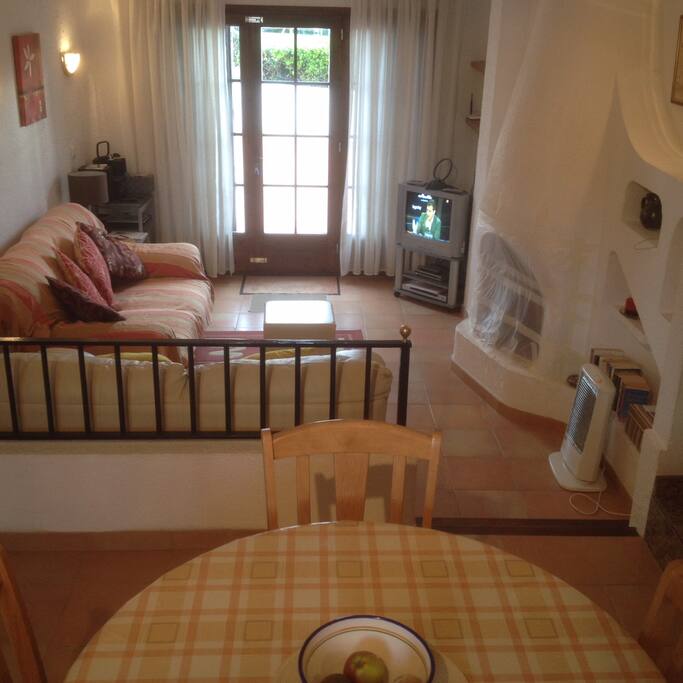 Living area opens to a large sunny terrace