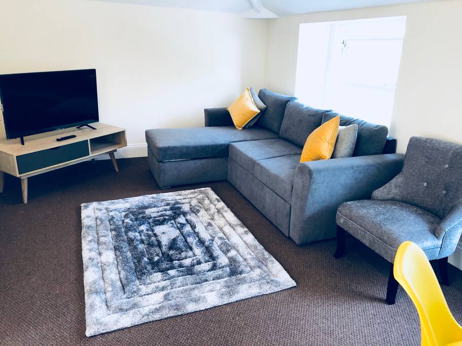 LIVING AREA WITH KINGSIZE SOFA BED.