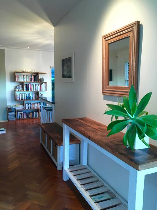 Entry hall looking left to upstairs lounge with flat screen TV and Netflix
