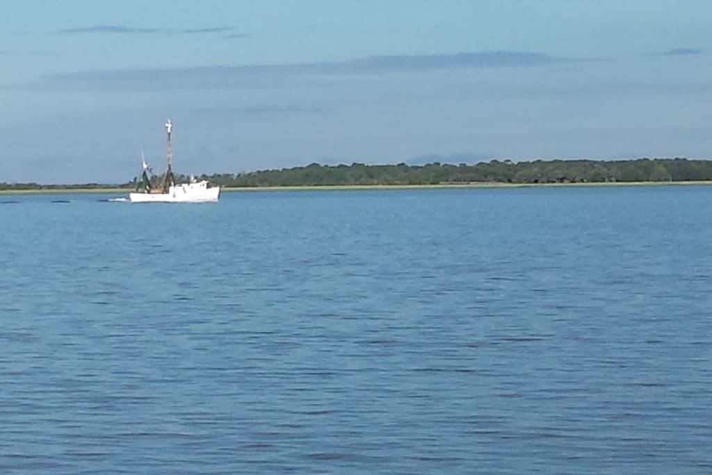 Shrimp boat passing Parris Island on the Beaufort River.