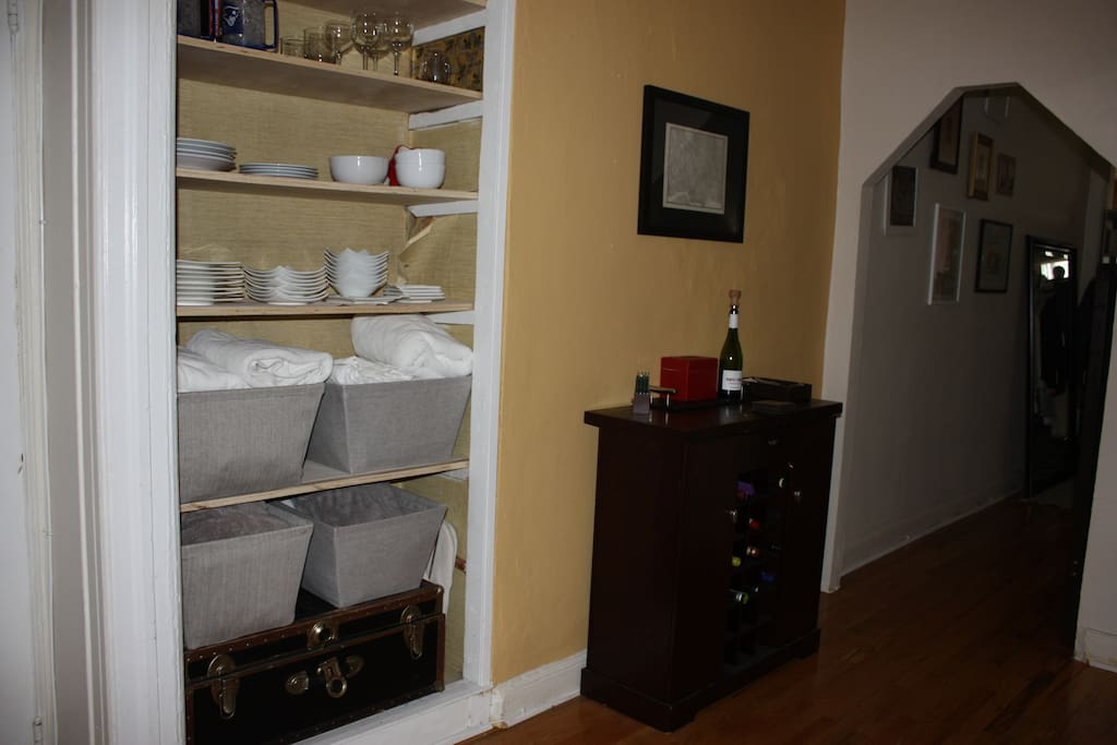 Bar cabinet and ample, exposed kitchen storage