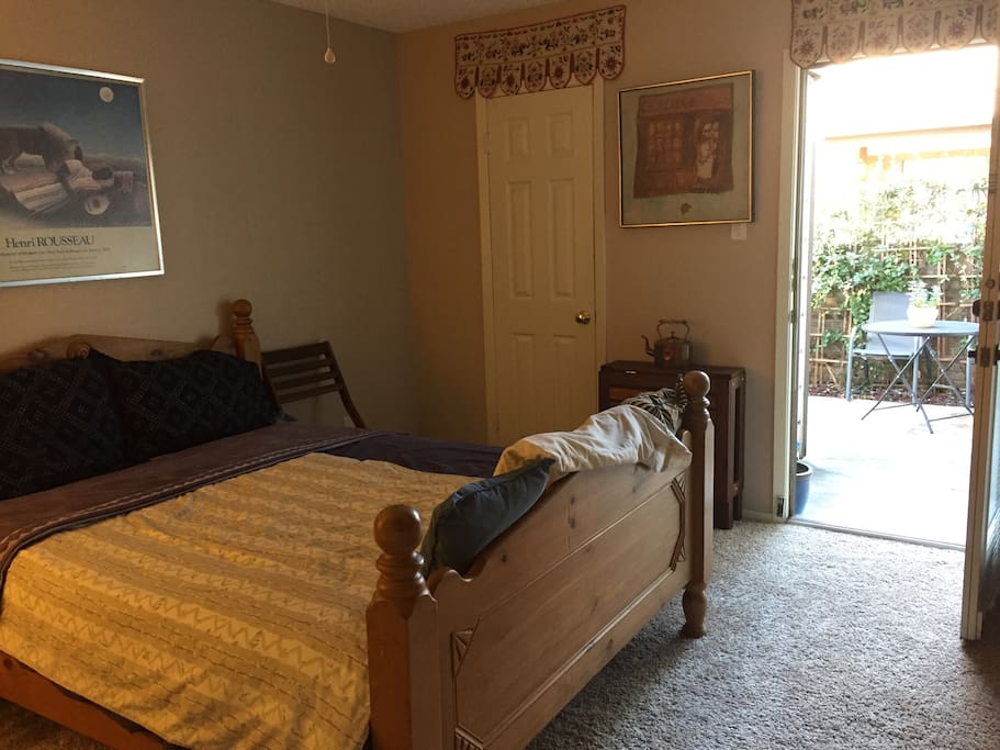 Master bedroom and private patio, perfect for breakfast, meals, reading, relaxing. Large closet, chest of drawers, table and chairs to work at.