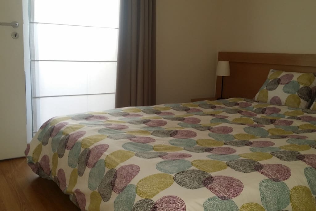 Main bedroom with balcony access