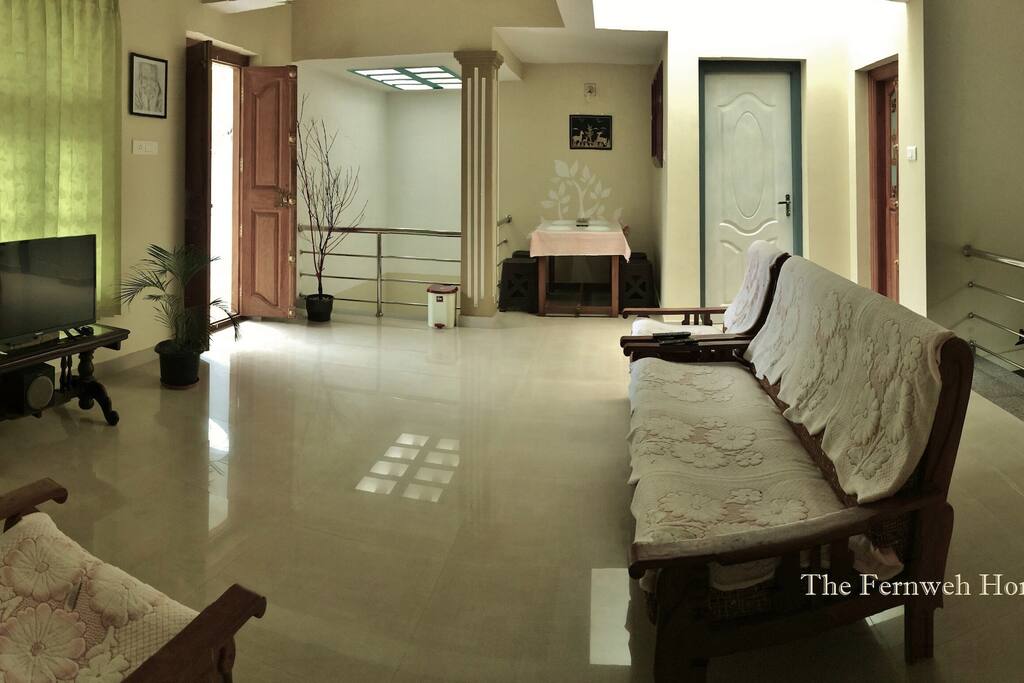 Spacious hall with Tv and Dining table.