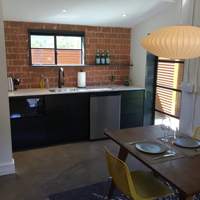 Marble counters, microwave and refrigerator