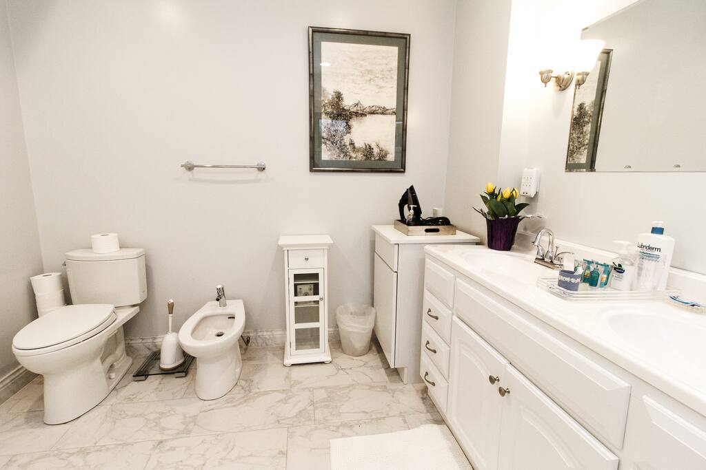 En suite bathroom with jacuzzi and glass enclosed shower