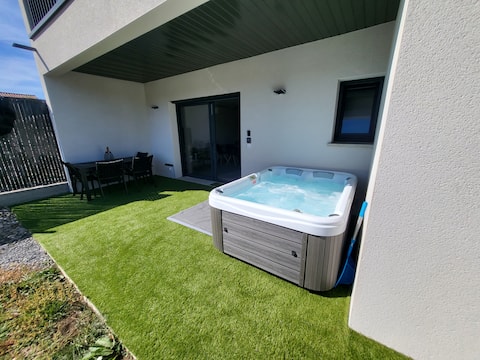 Ground floor of house with hot tub and arcade machine