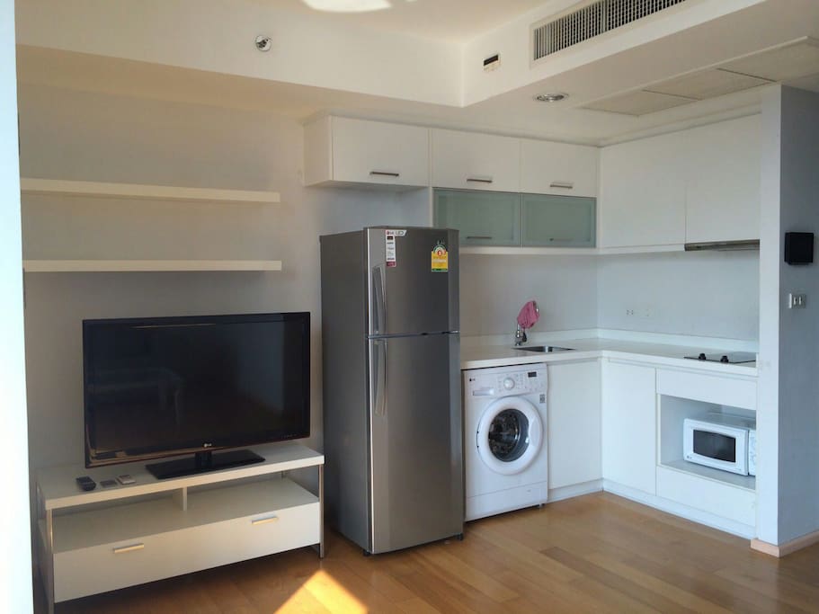 TV, Fridge, Washing machine, microwave and stove.