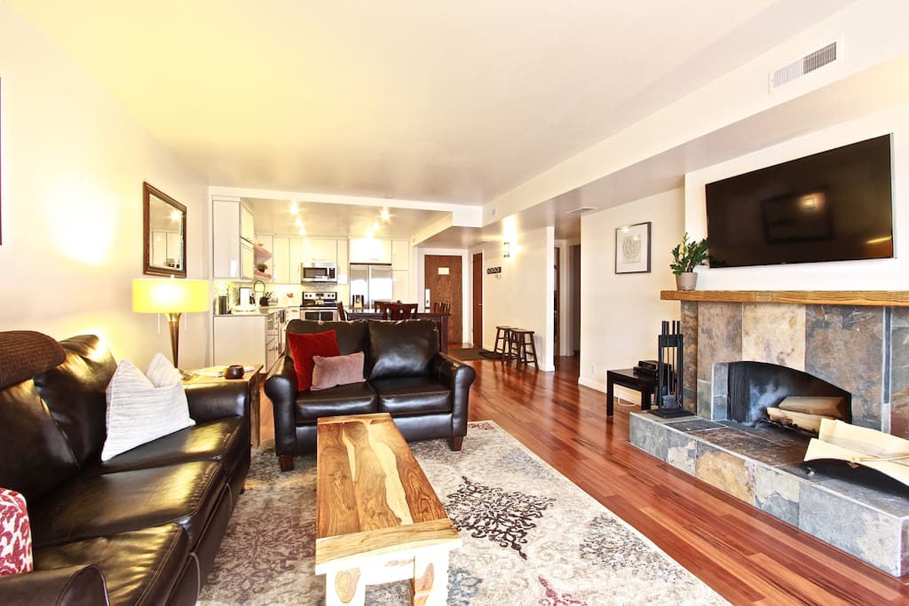 High end furniture and decor and a wood burning fireplace make our condo feel like home