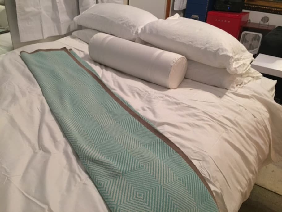 Cozy queen size bed.