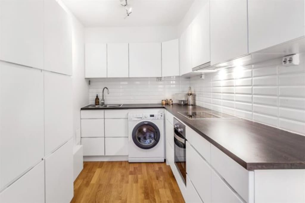 Kitchen with washing machine/dryer and dishwasher
