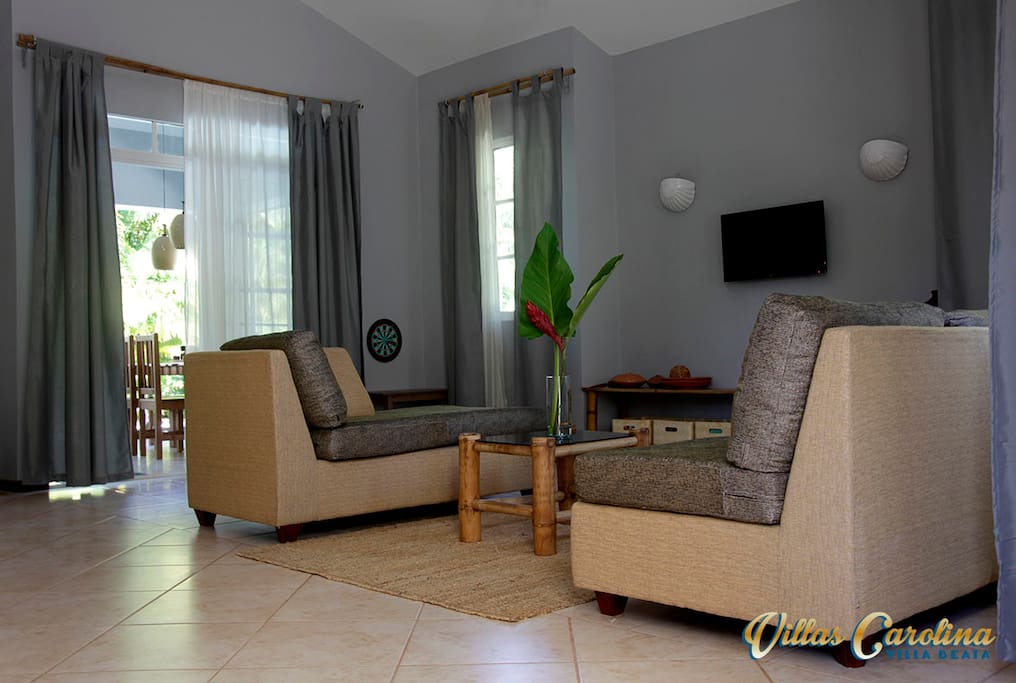 living room with door to the terrace and pool
