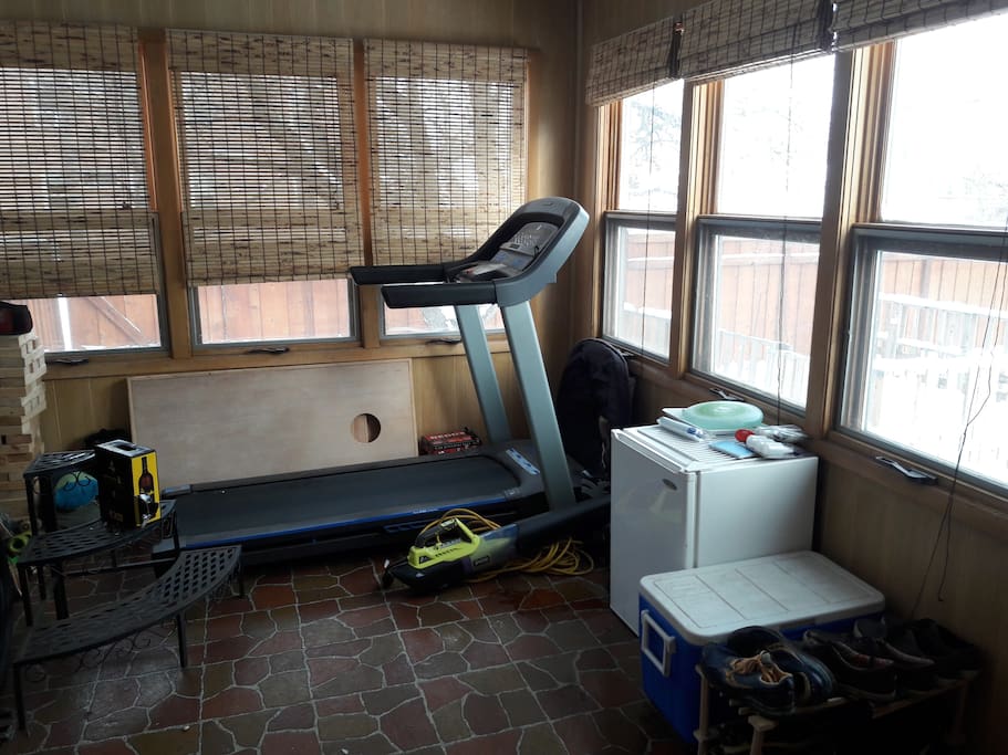 Treadmill overlooking our private fenced backyard, in case you're a runner!