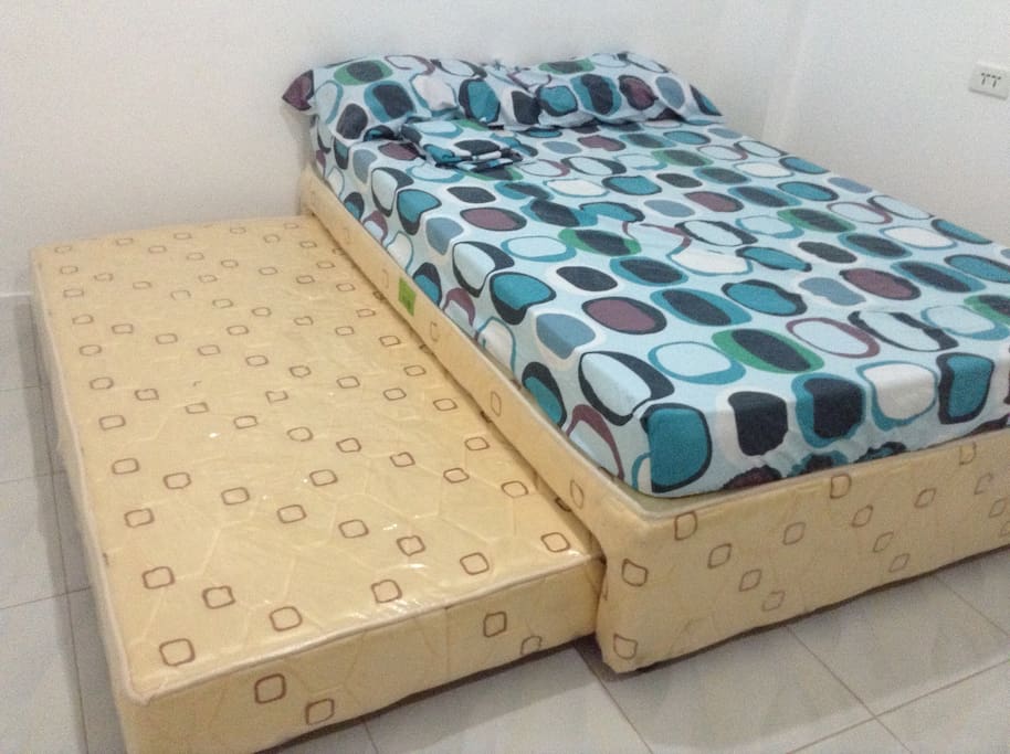 Full size bed with a pull out bed for your guest to spend overnight with you