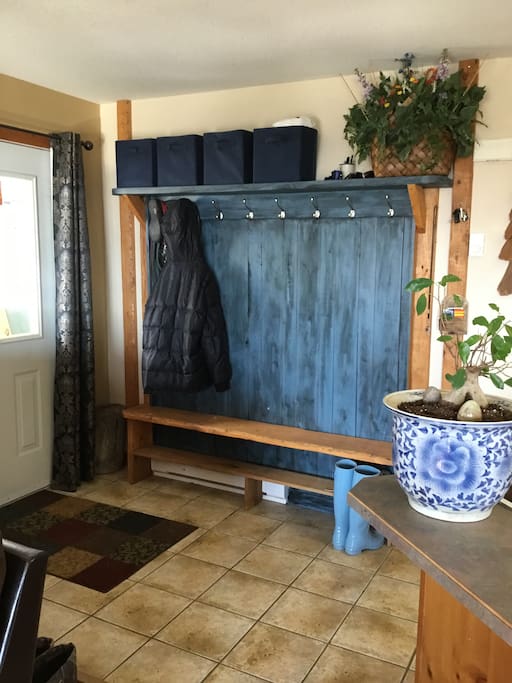 Entrance with bench and coat hooks.