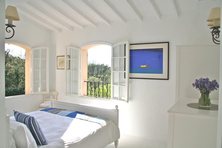 Bedroom on the First Floor. Stunning views over the garden and La Mole Valley. bedroom 1 shares a family bathroom with Bedroom 2. The family bathroom has a large bath with shower. A cupboard with baby / toddler equipment including 3 travel cots.