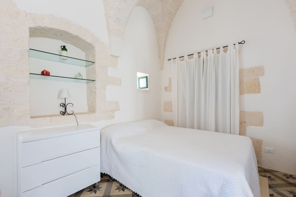 Sleeping area with plenty of storage in alcoves and cupboards