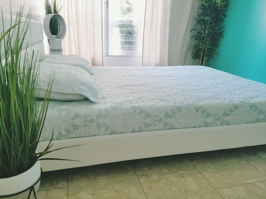 Queen sized bed with memory foam mattress and pillows