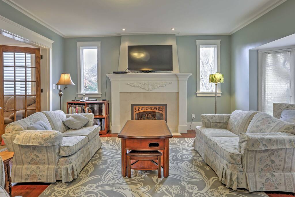 The elegant formal living room includes a lovely fireplace to keep you warm during the colder months.