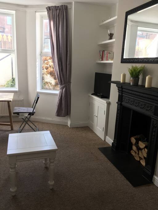 Living area, bay window with dinning table that seats 4.