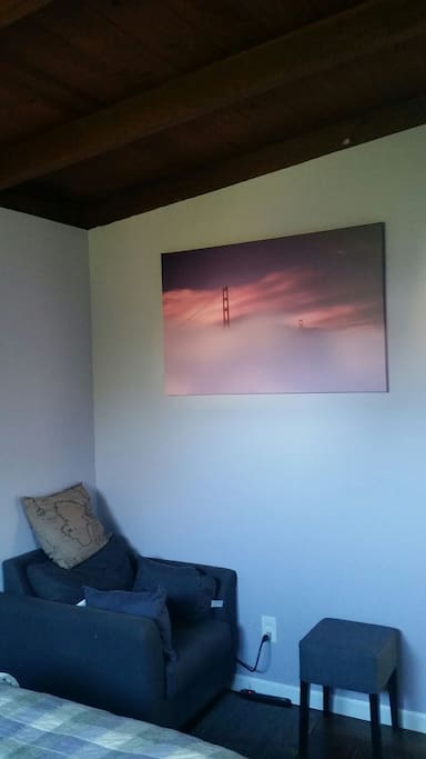 Armchair and view of exposed-beam ceilings
