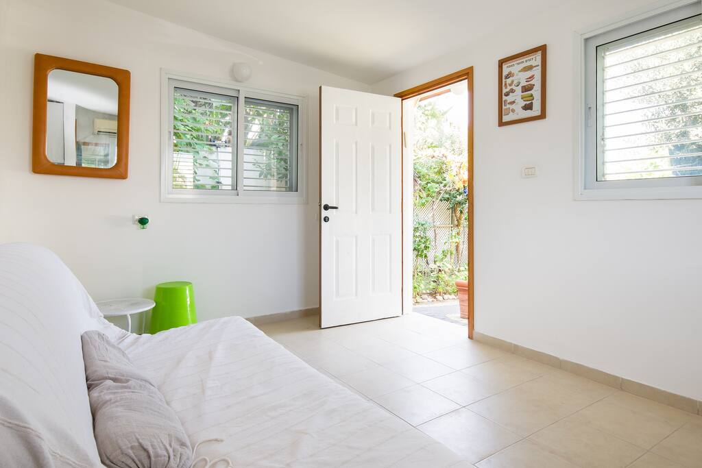Open door to the natural lighened garden