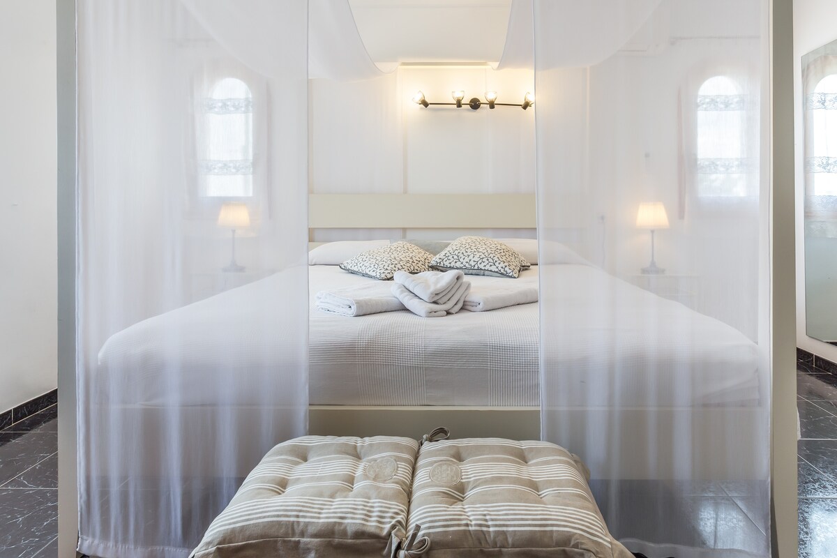 Master bedroom  King size bed center view, 2 mattress with different comforts.