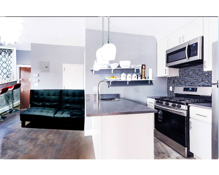 Gorgeous big living room and open kitchen with everything new. New refrigerator, new microwave, dishwasher and beautiful new stove.