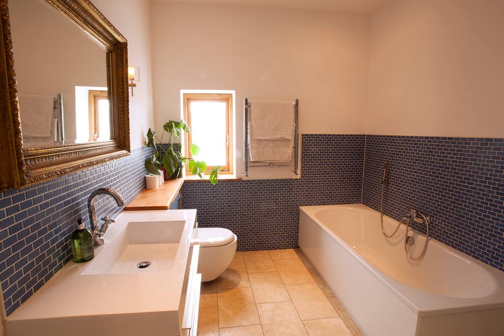 Bath with handheld shower