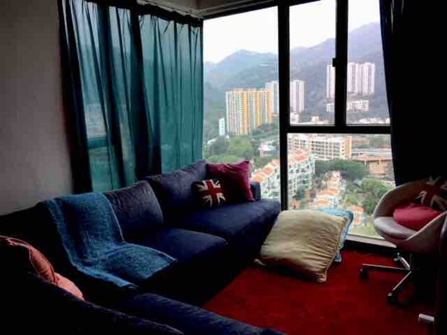 Spacious living room and couch by the window