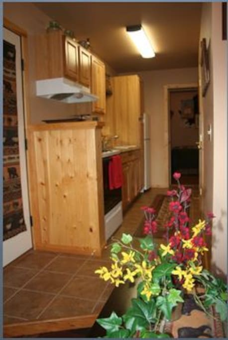 Full galley kitchen with full size oven/range and refrigerator.