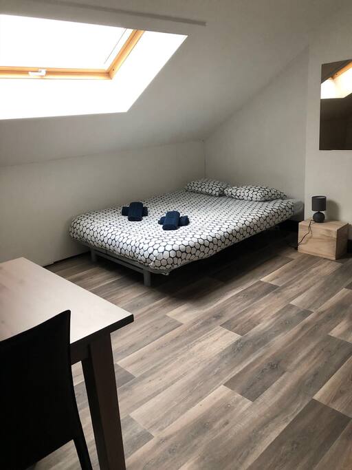 Bedroom 2 with table.