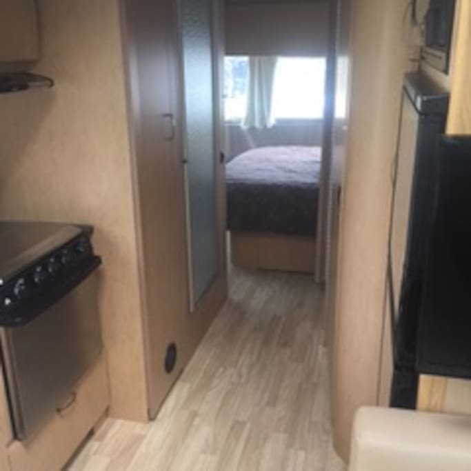 This is a view of the of the Shower, bathroom and back bedroom