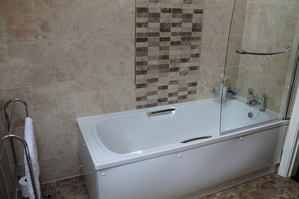Bath with shower over