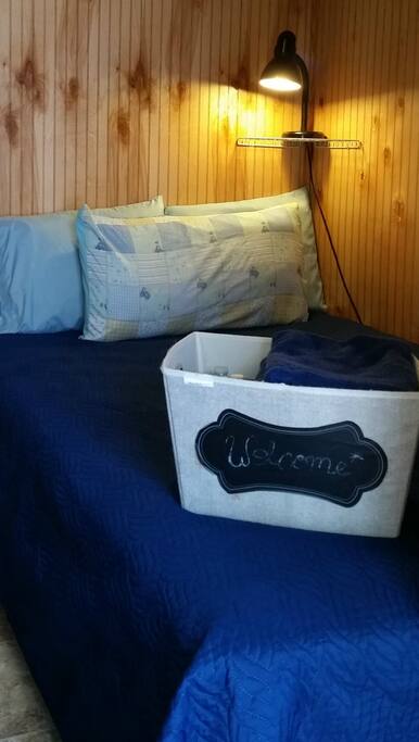 Welcome to your tiny house. Your Welcome Basket includes towels, earplugs and complimentary bottled water.
