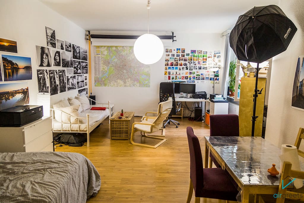 The spacious room serves as a bedroom, a living room, a dining room and a photo atelier.