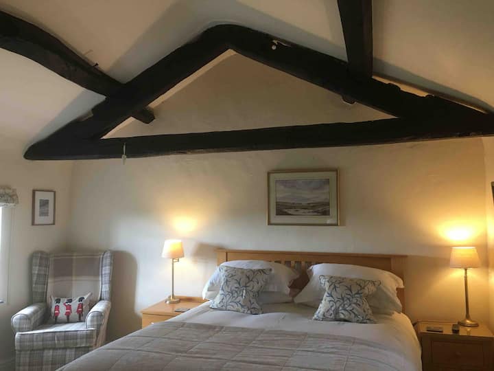 A comfortable bed and an armchair with a view.. essential after a long day’s walking! 