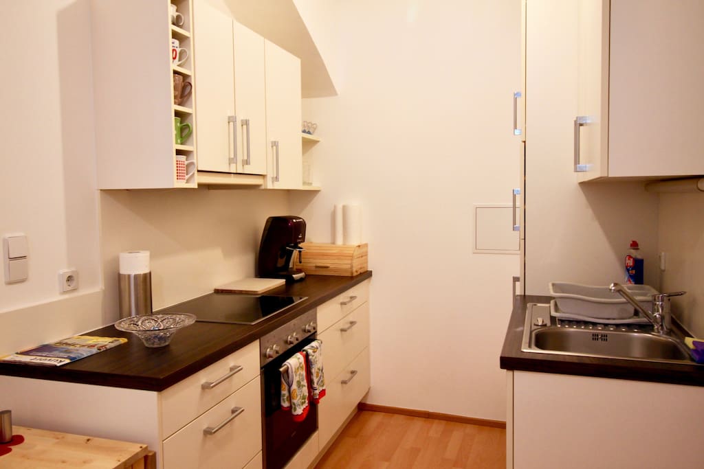 Kitchen equipped with : coffee machine with capsules ( Tchibo ), dishwasher, refrigerator, stove+oven.