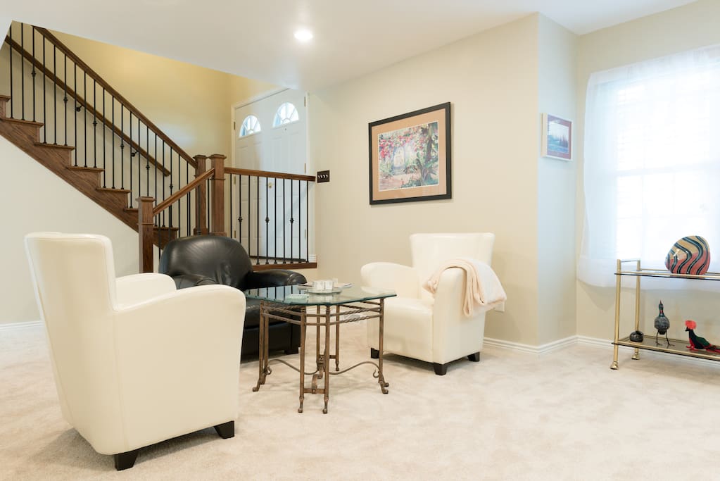 The living room is yours to use for conversation or to watch TV.