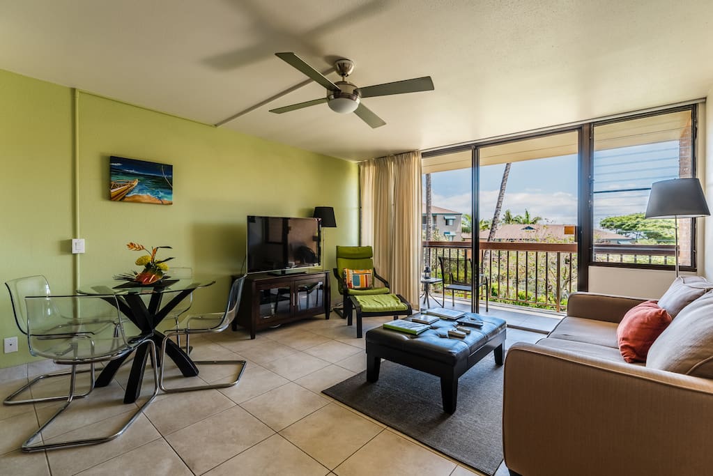 Your super-comfortable living area with entertainment center, dining, and queen sofa sleeper with custom mattress!