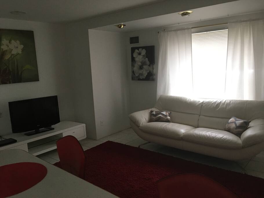 Living room area. Couch, love seat and flat screen 32” TV