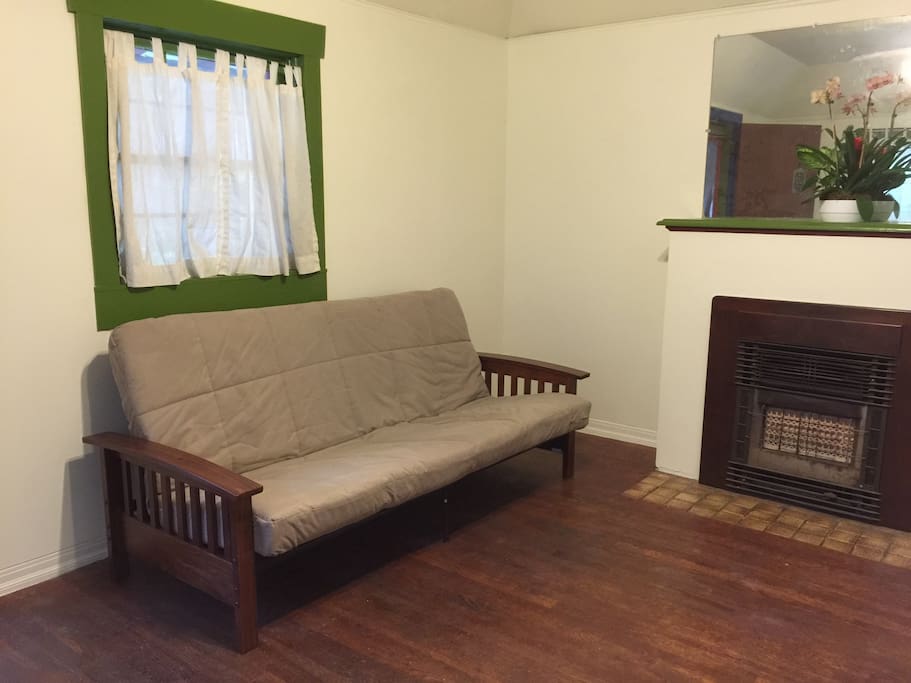 Futon/full size bed in livingroom.
