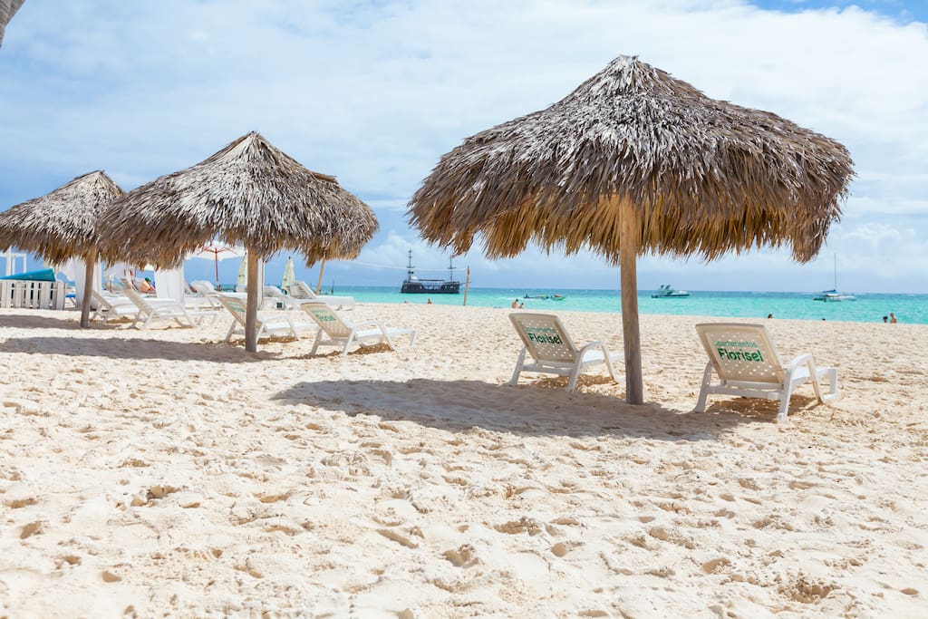 Our private beach with private beach loungers and parasols