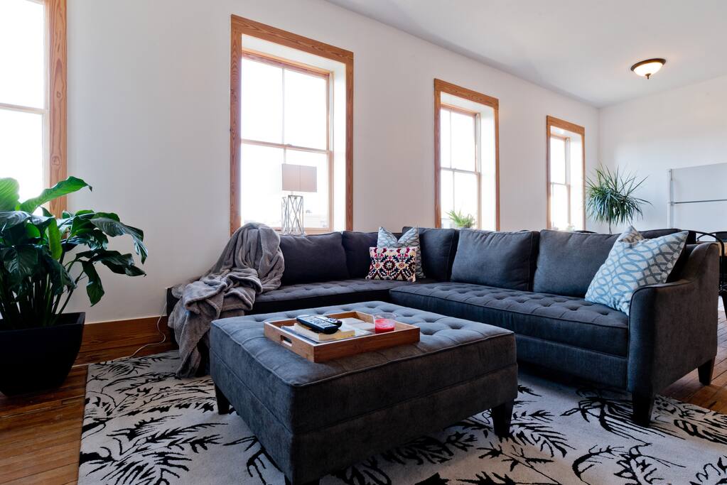 Ottoman slides into couch to create a large bed, perfect for a 5th guest or additional couple to share.