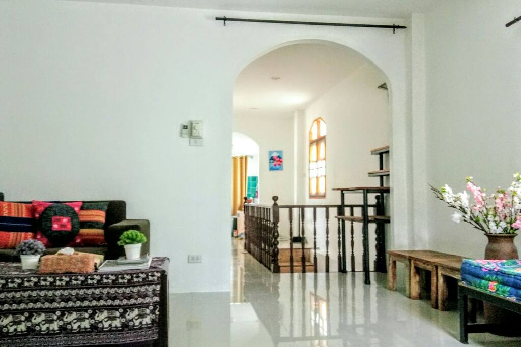 A view that shows the walkway that connects the living room and the kitchen. The living room comes with an AC.