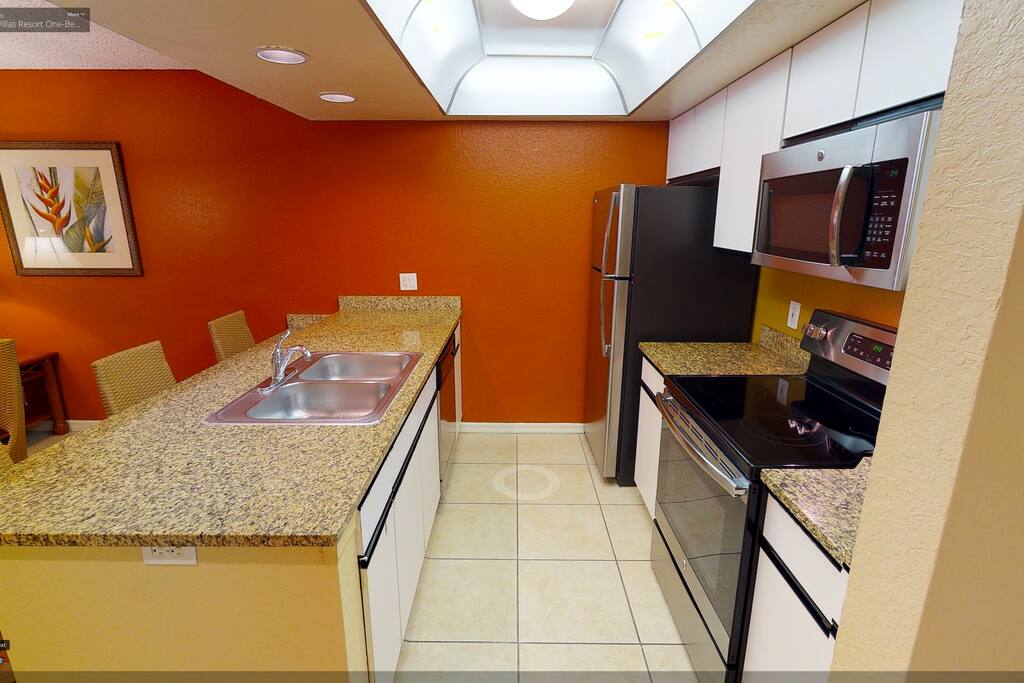 Kitchen all facilities refrigerator, stove and oven, microwave, and eating utensils pots, pans and dishes just like home.