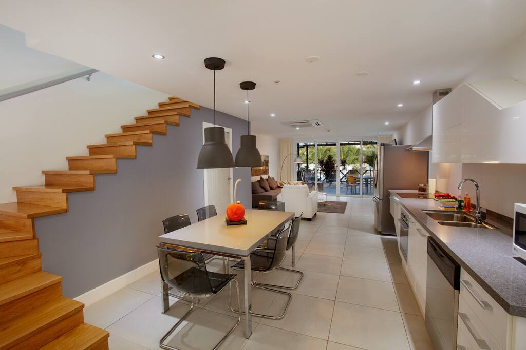 Dining area with 6 chairs, stairs to first floor