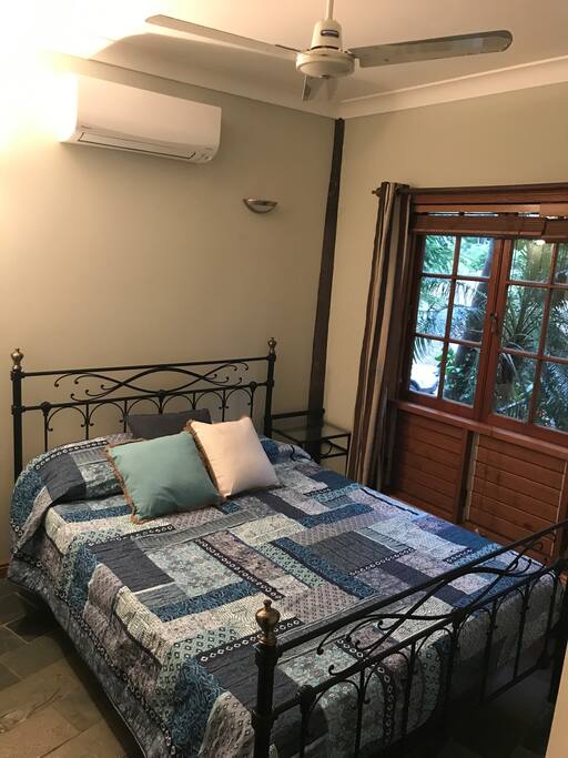 Bedroom 1 - Queen bed, air con, fan, cupboard with hanging space